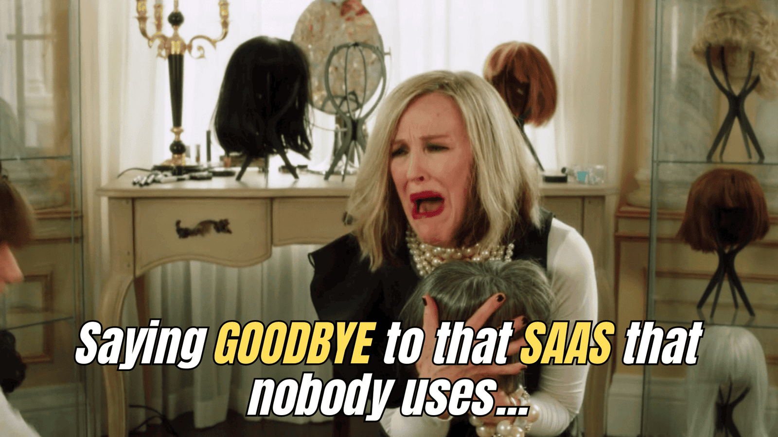 Moira Rose from Schitt’s Creek clutches her wigs dramatically, captioned: “Saying goodbye to that SaaS that nobody uses.”